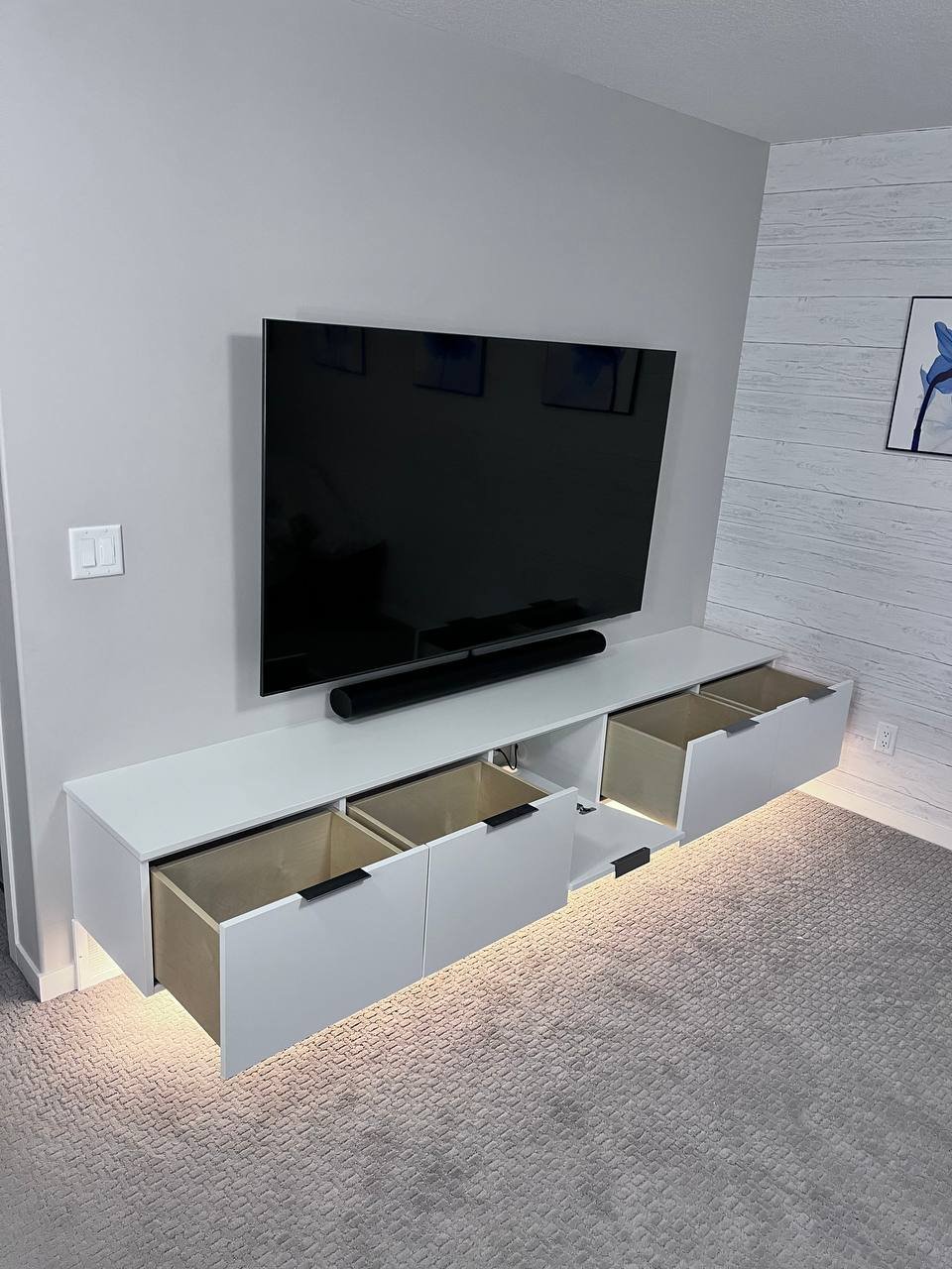 Floating entertainment center with LED lighting by Bow Wood Co. Calgary